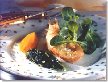 Langoustine sur lit de mâche et quenelle de carotte confite à l'orange